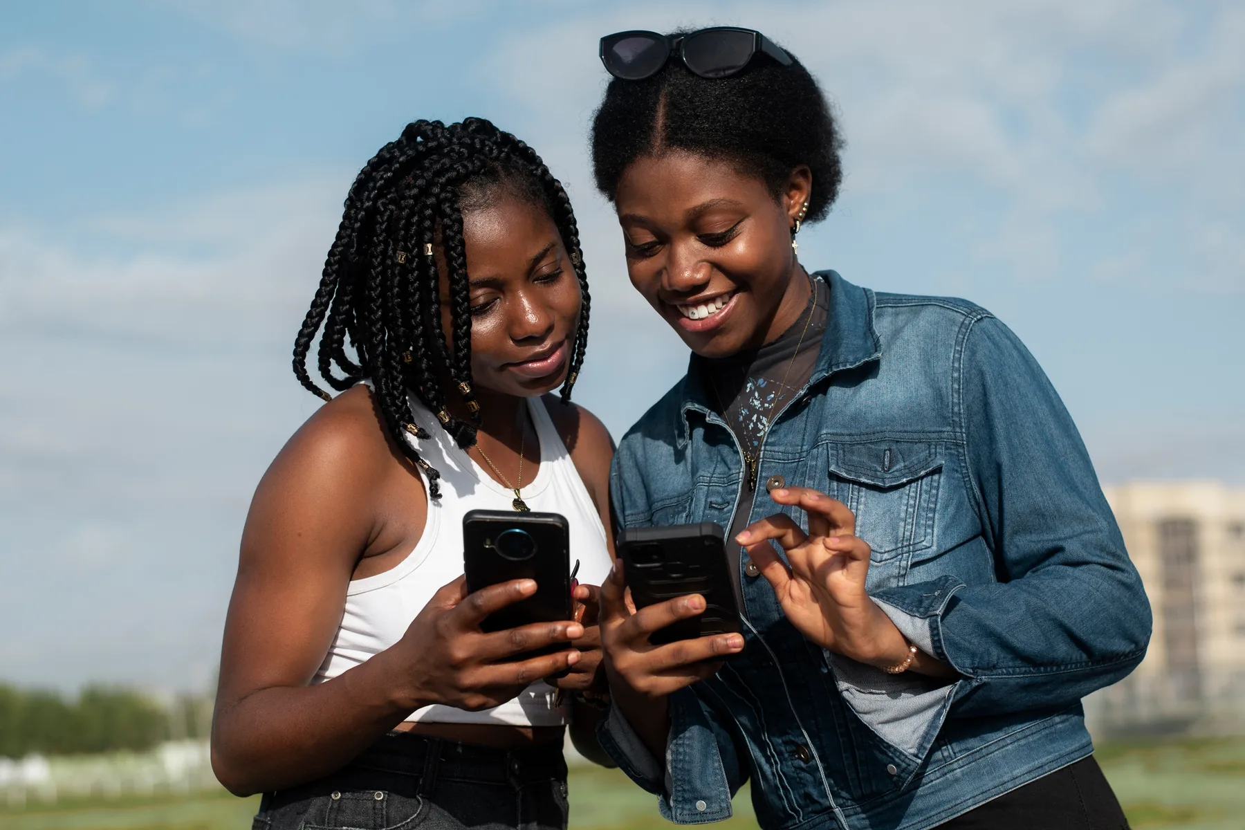 Two friends laughing at a phone